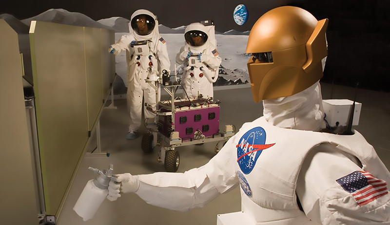 NASA’s first Robonaut robot holding a spray bottle