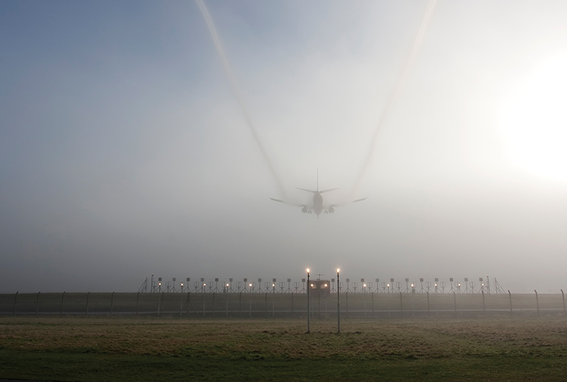 Jet making a landing in fog