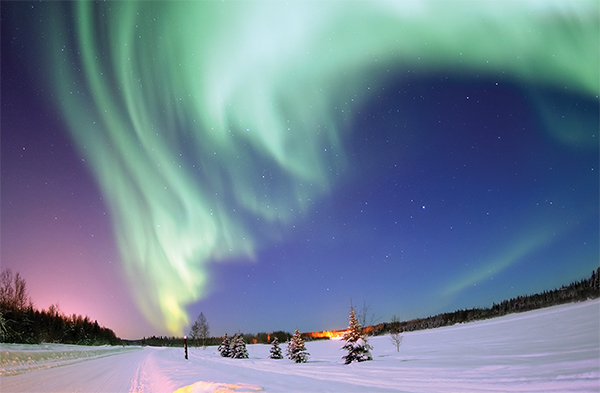 Northern Lights above snowy landscape