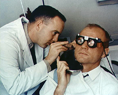 A NASA scientist examines John Glenn’s eye motions