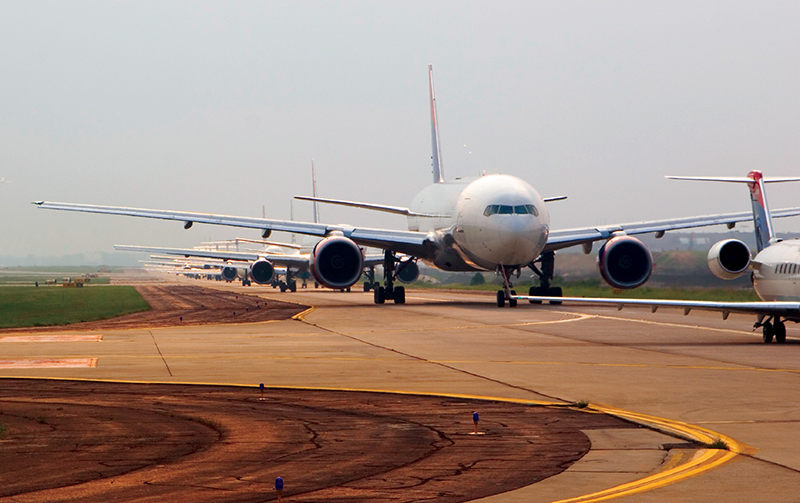 Planes waiting on a runway