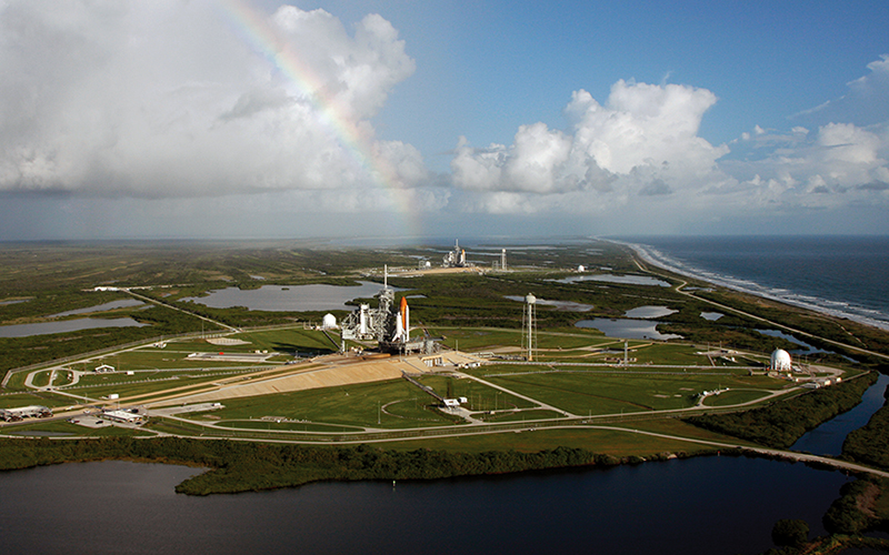 The Space Shuttles Atlantis and Endeavor sit on launch pads.