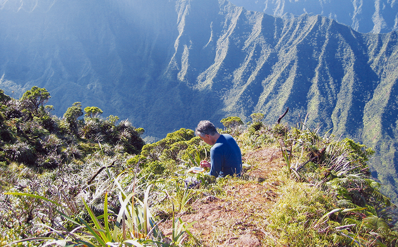 Researcher installing Intelesense unit on mountain