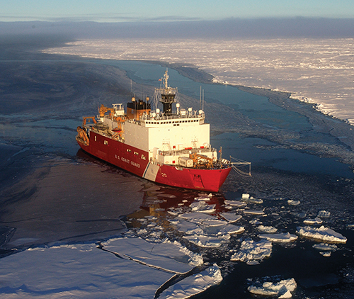 A U.S. Coast Guard cutter moves through Arctic ice.