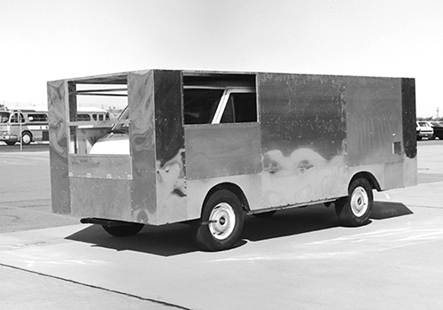 A delivery van boxed in aluminum sheets tests aerodynamic drag.