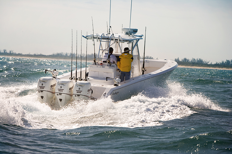 A boat with three Evinrude E-TEC outboard engines