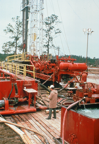 A Texaco inspector performs a routine quality control check