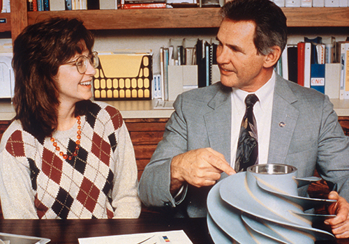 Leonard Hill of North American Marine Jet and Dinah Higgins of Marshall Space Flight Center display an impeller blade made by advanced rapid prototyping techniques