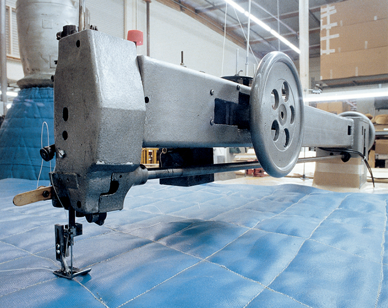 A quilting machine is used to fabricate thermal blankets for the Space Shuttle.