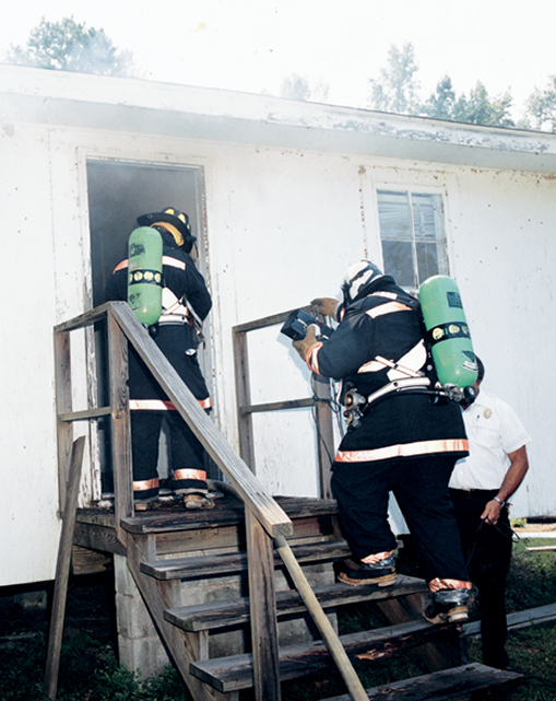 Firefighters illustrate how the fire imager can be used to see through dense smoke