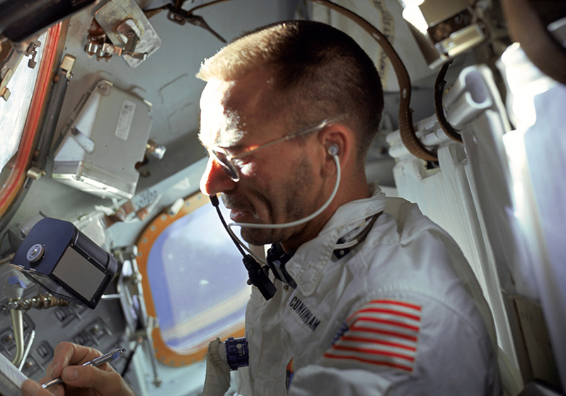 U.S. astronaut Walter Cunningham writes with a Fisher Space Pen during the flight of Apollo 7, 