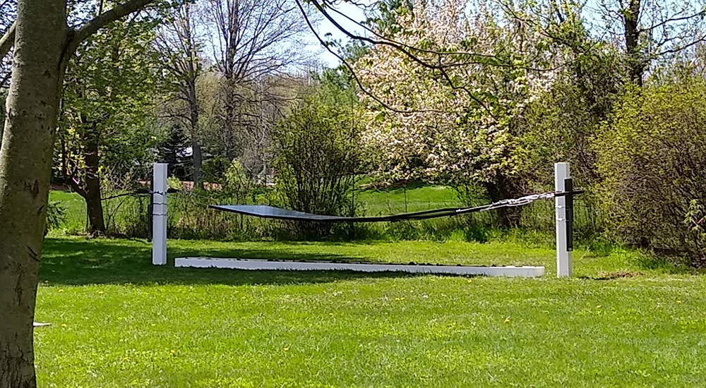 The Skysun Solar Pollinator suspended between two posts