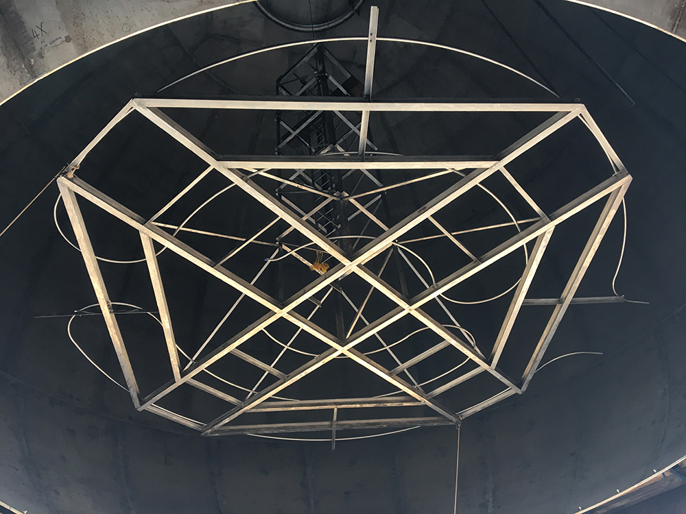 The heat exchanger is hoisted in the interior of NASA’s new liquid hydrogen tank