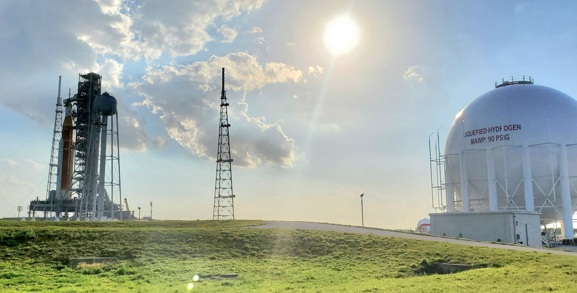 The liquid hydrogen tank CB&I just built, the largest in the world, sits at Kennedy Space Center’s Launch Complex 39B, where it will support launches of NASA’s Space Launch System, seen here on the left