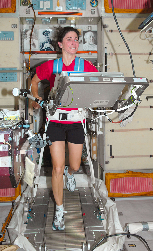 NASA astronaut Nicole Stott works out on a treadmill on the International Space Station