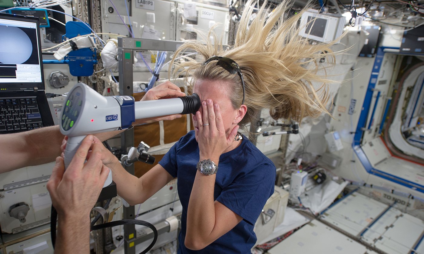 Astronaut Karen Nyberg undergoes an ocular health fundoscopic exam on the International Space Station