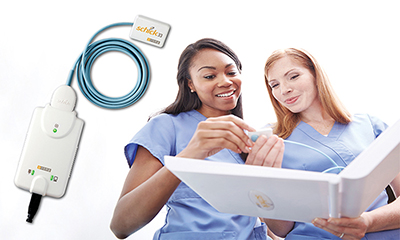 Medical professionals holding a Medical professionals holding a Schick dental imager