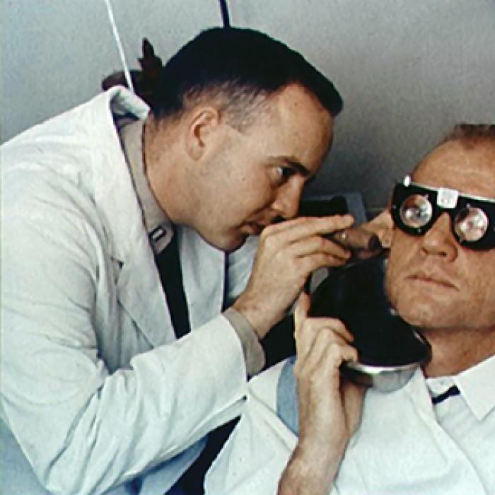 A NASA scientist examines John Glenn’s eye motions