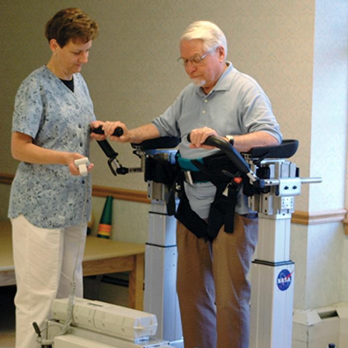 A nurse guides a patient using the Secure Ambulation Module