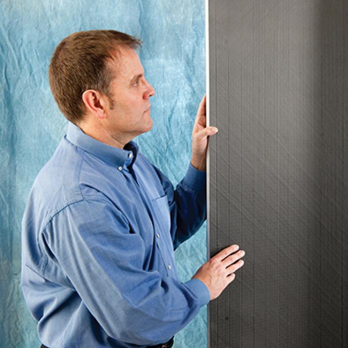 Man with TYCOR panels