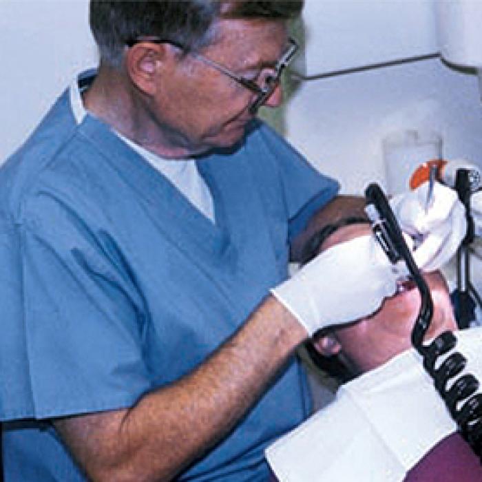 A dentist gives this patient the cleanest of water while dental tools do their work