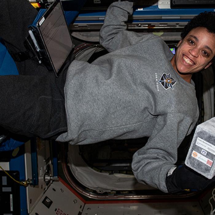 Astronaut Jessica Watkins holds a Nature’s Fynd bioreactor on the International Space Station