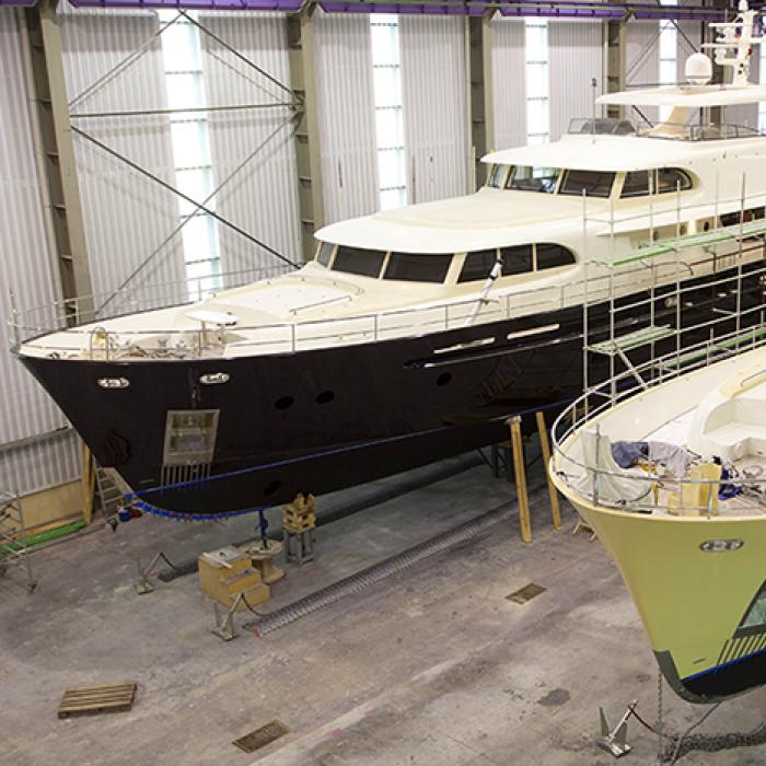 Yachts inside a service facility