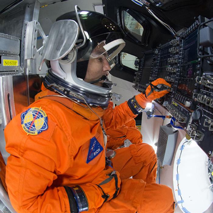 An astronaut during tests aboard the Orion spacecraft