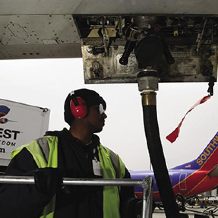 Mechanic fueling plane