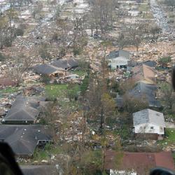 U.S. Navy crewmen surveying damage from Hurricane Katrina