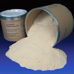 Petroleum Remediation Product in powder form spilling from a container