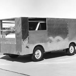 A delivery van boxed in aluminum sheets tests aerodynamic drag.