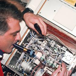 Astronaut with a bioreactor unit