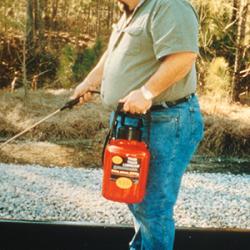 Sun Coast Chemical's Chris Fornili sprays railroad tracks with a special lubricant 