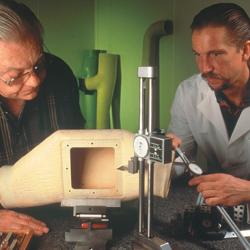 Two men conduct a quality control test on the Ultra Seal Duct component