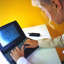 A nurse uses Home Care Connect with a laptop and the Internet