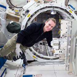 Astronaut Kate Rubins in front of the Japanese Experiment Module Airlock