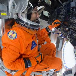 An astronaut during tests aboard the Orion spacecraft